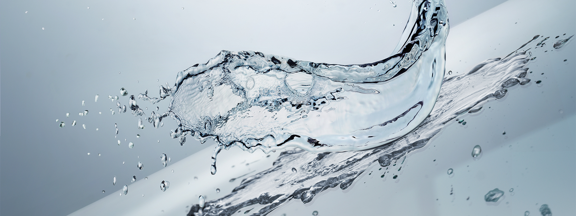 A splash of clear liquid on a large surface.
